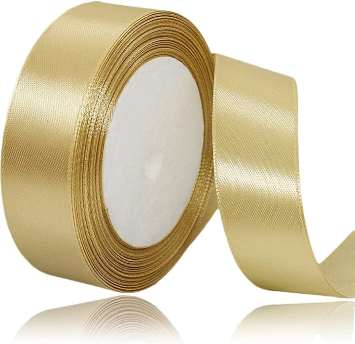 Gold ribbon roll with text indicating length on a white background