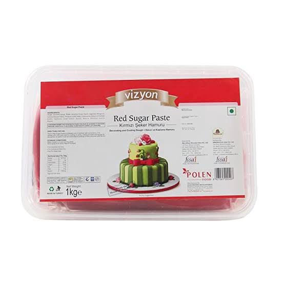Packaged red sugar paste with a cake illustration on a white background
