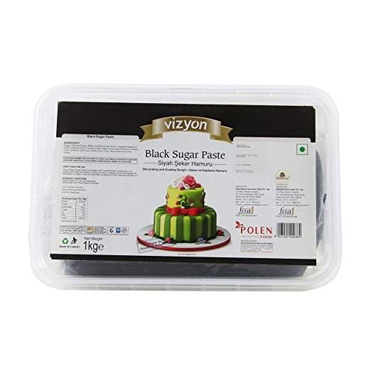 Packaged black sugar paste with a cake illustration on the label, brand 'Vizyon' visible.