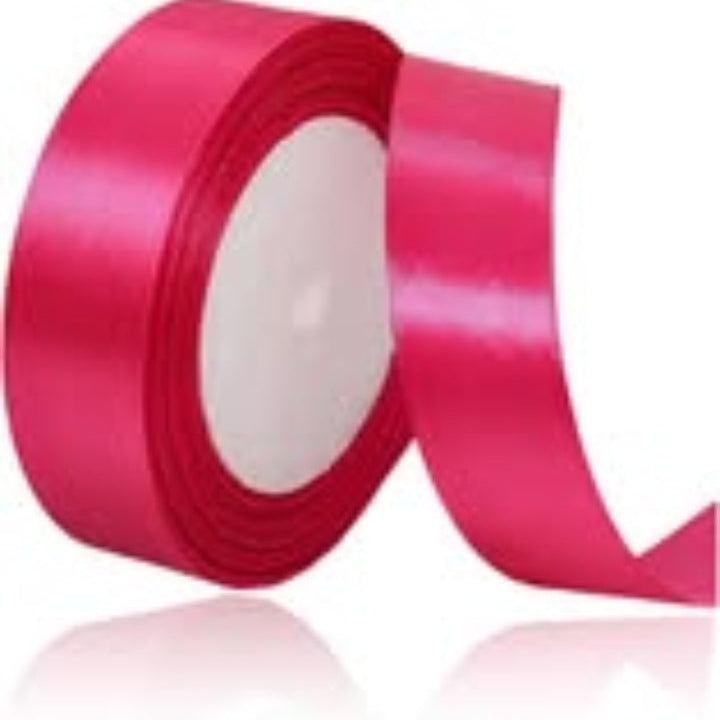 Roll of red ribbon with text indicating length on a white background