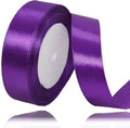 Purple ribbon roll on a white background