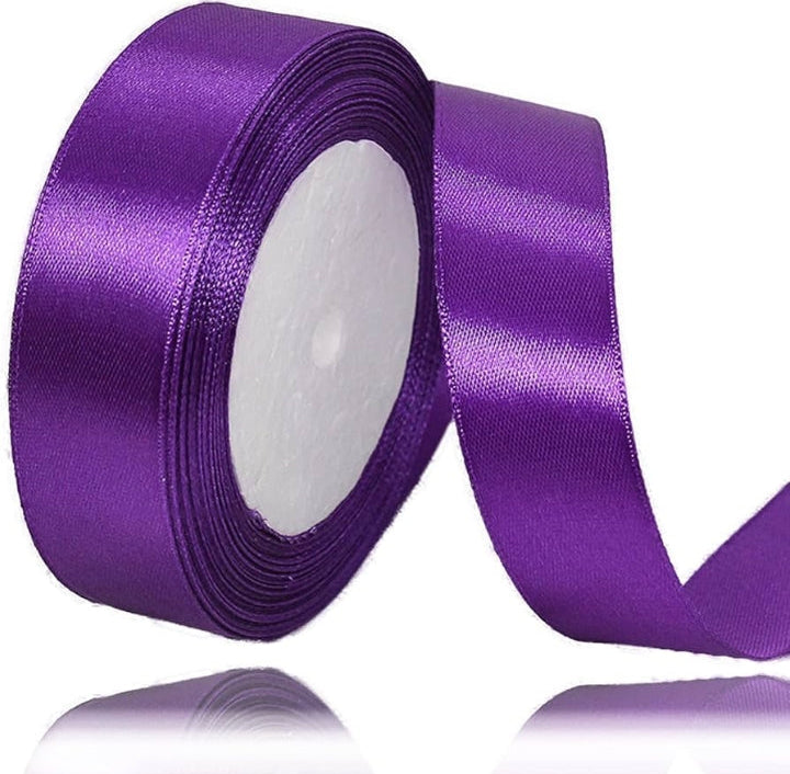 Purple ribbon roll on a white background