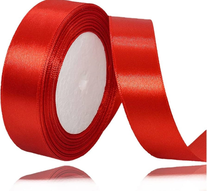 Red ribbon roll with text indicating about 10 yards on a white background
